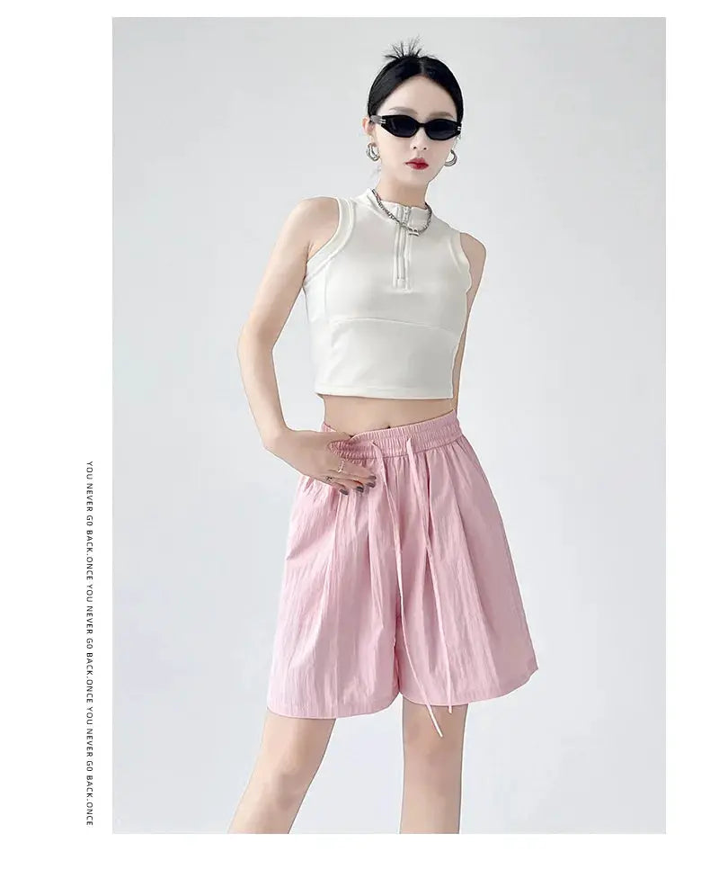 Women's pink casual shorts with elastic waist, drawstring, and two pockets, loose fit