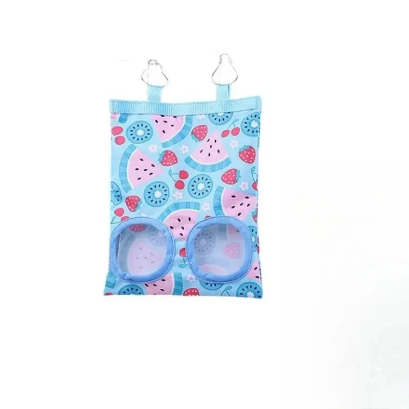 Rabbit hay bag; blue patterned fabric hanging feeder with two round hay-access holes for small animals.