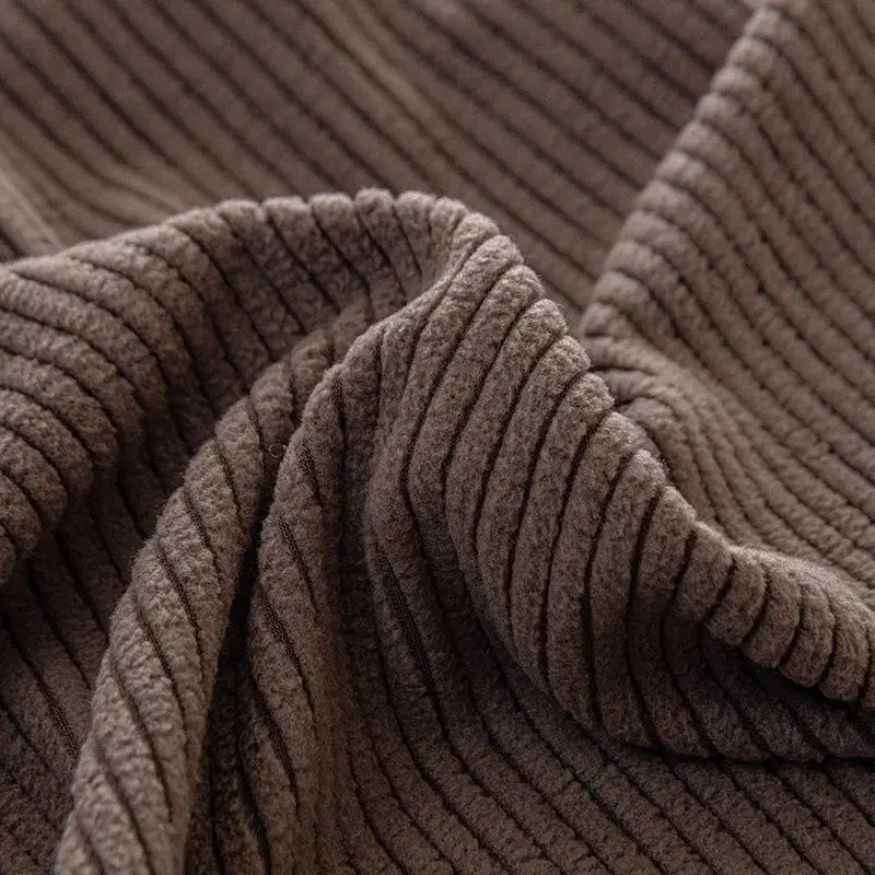 Plush brown corduroy sofa cover with elastic edges, removable cushion protector.