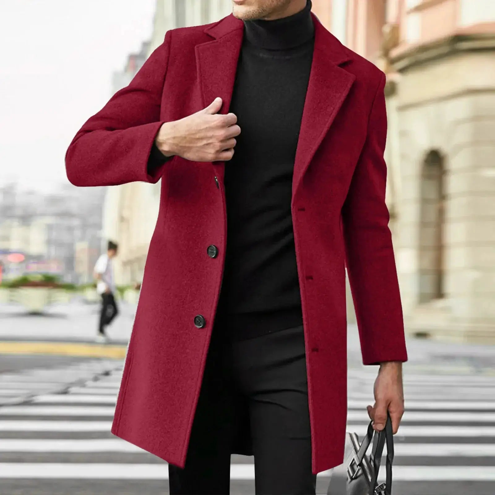 Mens red wool-blend trench coat, buttoned, worn over black turtleneck in an urban street scene