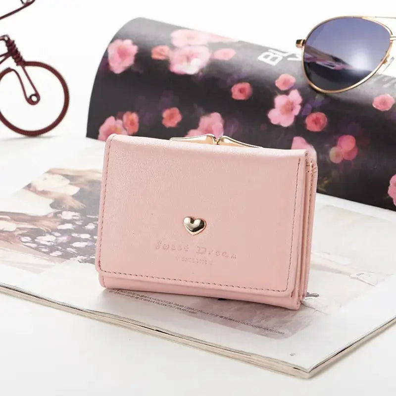 Pink mini wallet by Simples Market with gold heart clasp, foldable compact purse
