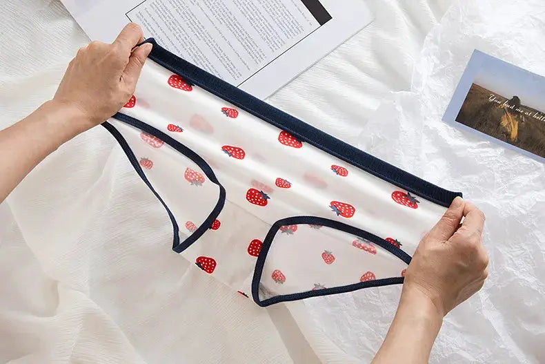 Cotton women's underwear briefs with strawberry print on white fabric and navy trim