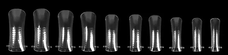 Nail extension gel set: 12 clear nail extension forms lined up for UV gel manicure