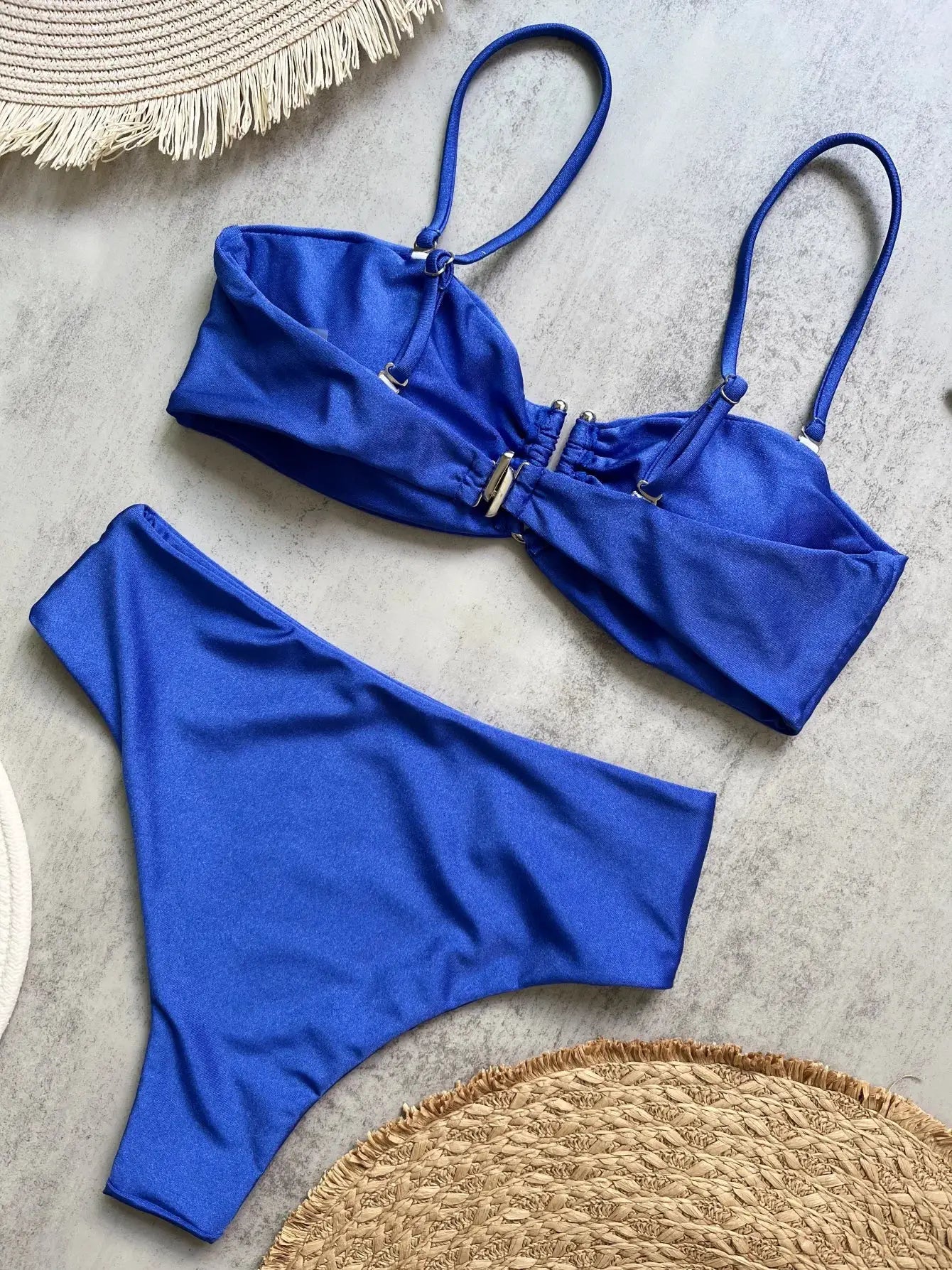 Blue bandeau bikini set with adjustable straps and metal clasp, matching bottoms
