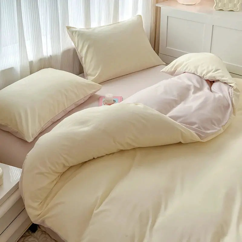 Simples Market 4-piece brush fabric bed set with two-tone cream and pink reversible duvet cover and pillowcases.
