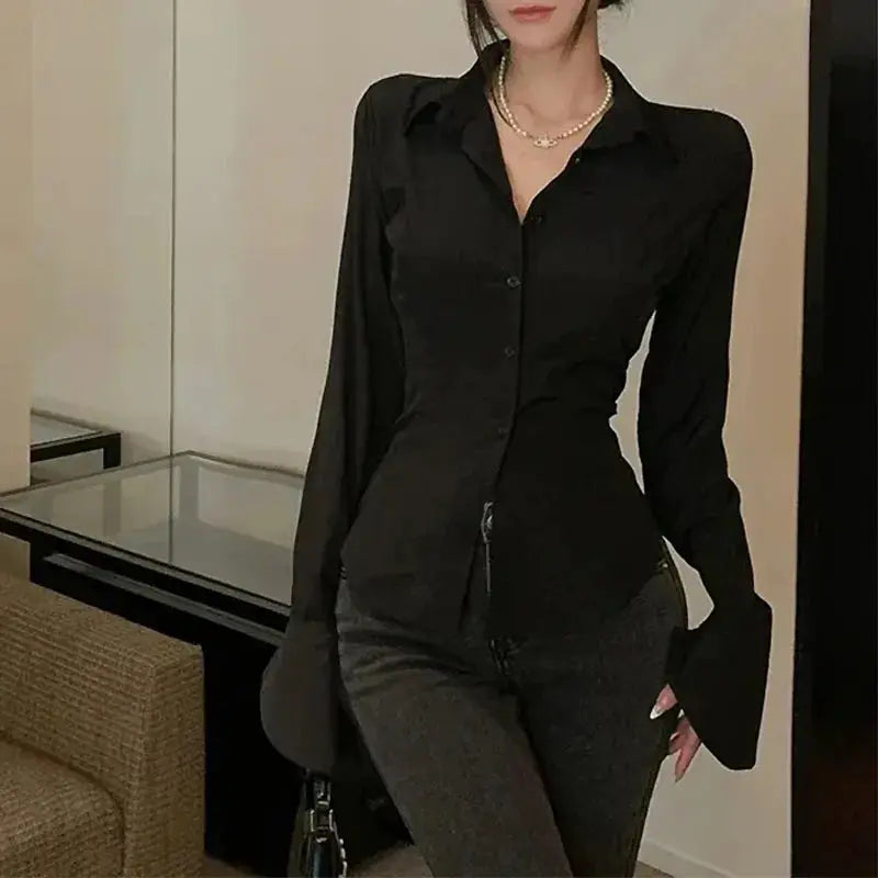 Black women's bandage blouse with button front and bell sleeves for casual streetwear.