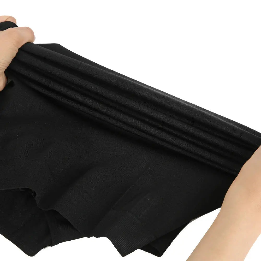 Men's black high-compression tummy-control body shaper top, stretchy fabric