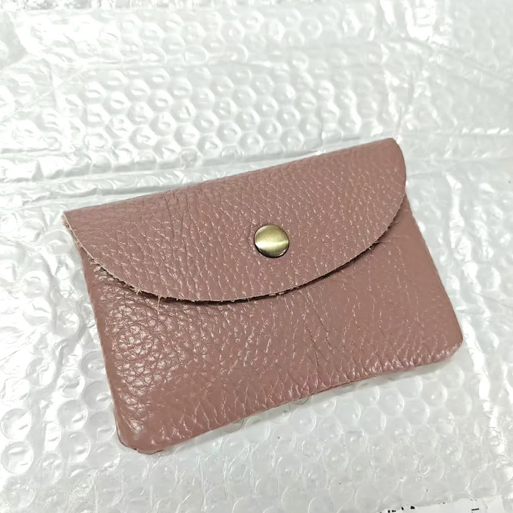 Personalized pink genuine leather card holder with envelope-style flap and brass snap
