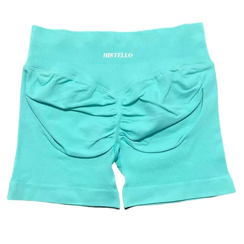 HISTELLO turquoise sports shorts for women, low waist, seamless scrunch back, breathable fabric.