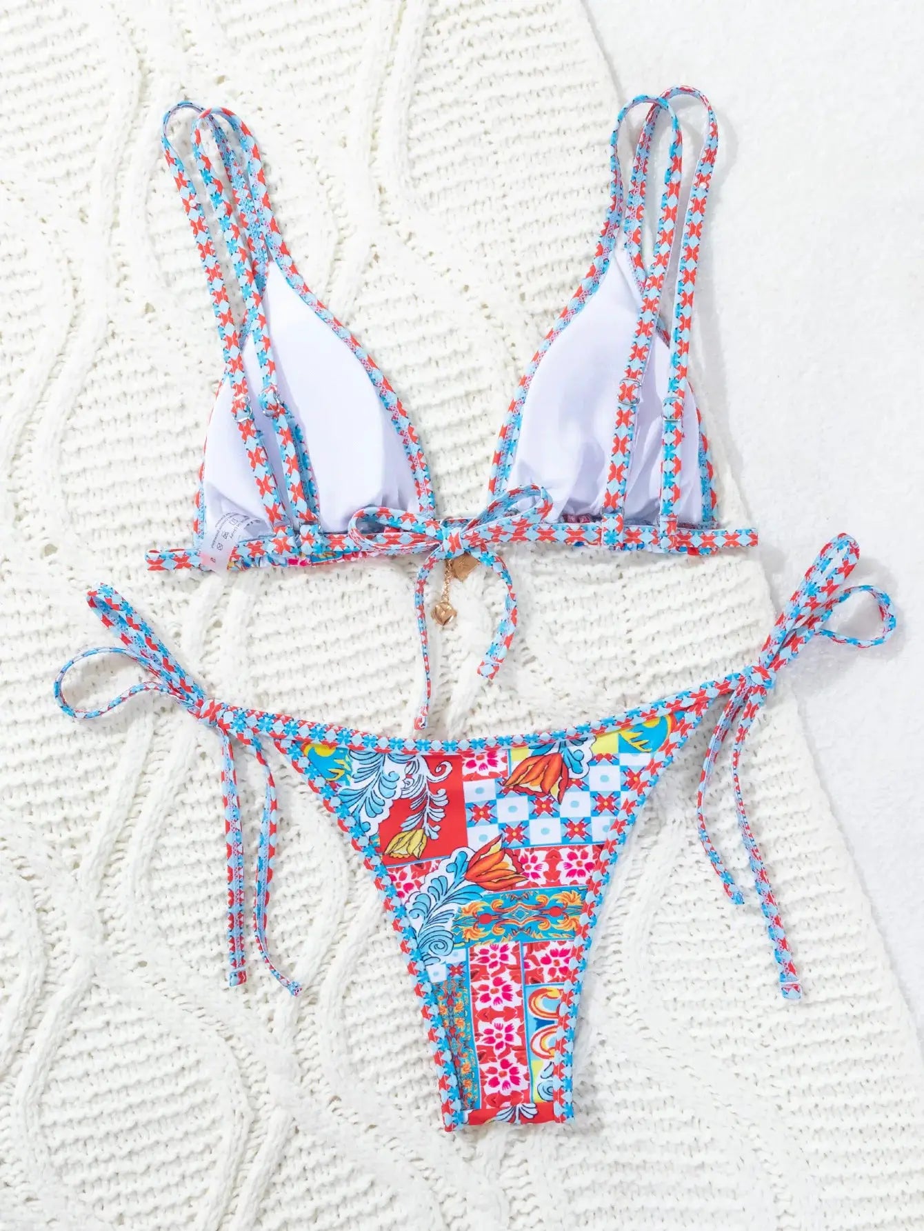 Simples Market 2026 triangle push-up bikini; white cups with patterned straps, colorful patchwork Brazilian bottoms