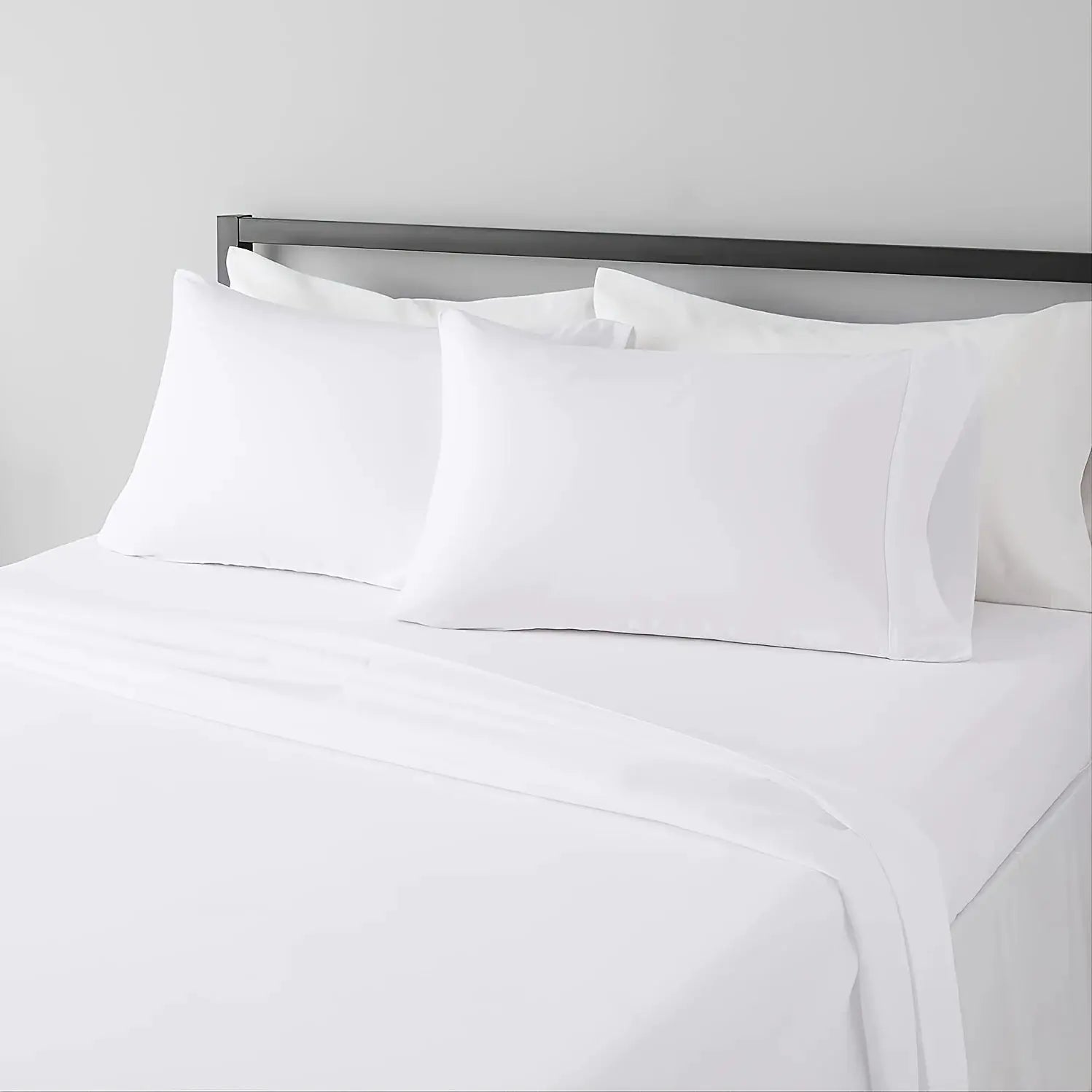 Sheet set white bed sheets with 3 white pillows on a bed