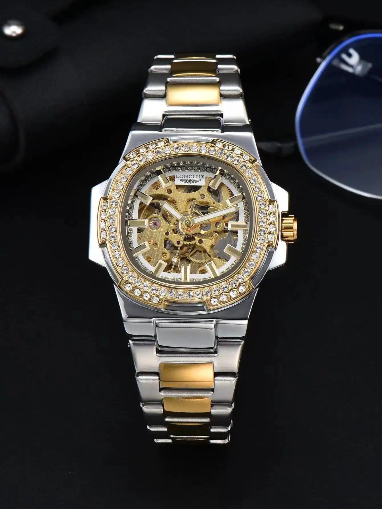 LONGLUX skeleton automatic men's watch with two-tone stainless steel bracelet and diamond-studded bezel.