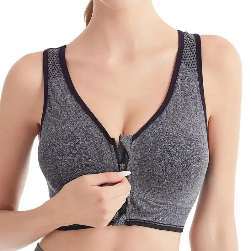 Front-zip sports bra for running in metallic gray seamless fabric with black trim