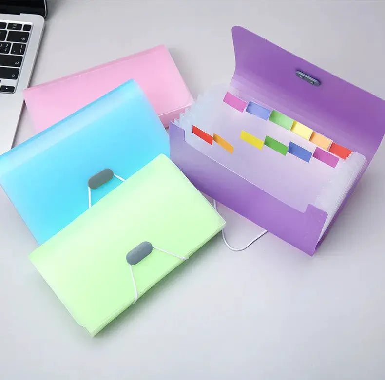 Simples Market 4-piece A6 expanding file folder set in pastel pink, blue, green and purple with tabbed dividers.