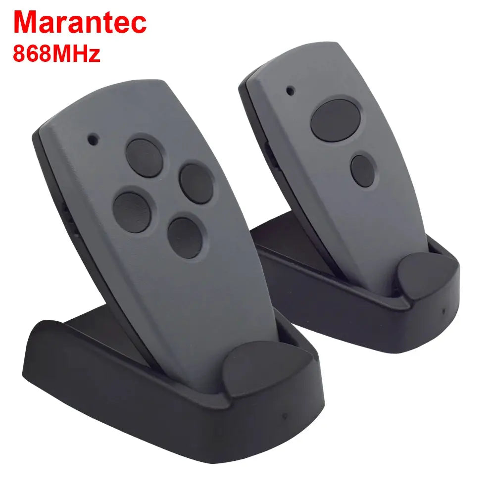 Garage door remotes (2) grey with four buttons on black stands Marantec 868MHz