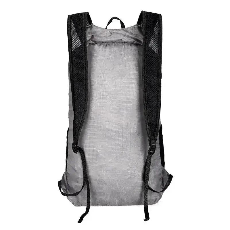 Back view of an ultralight foldable 20L hiking backpack with adjustable straps and lightweight design.