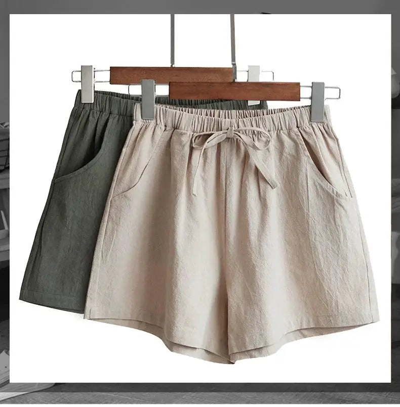 Casual linen shorts for women with drawstring waist and pockets, beige and olive green, hanging on hangers
