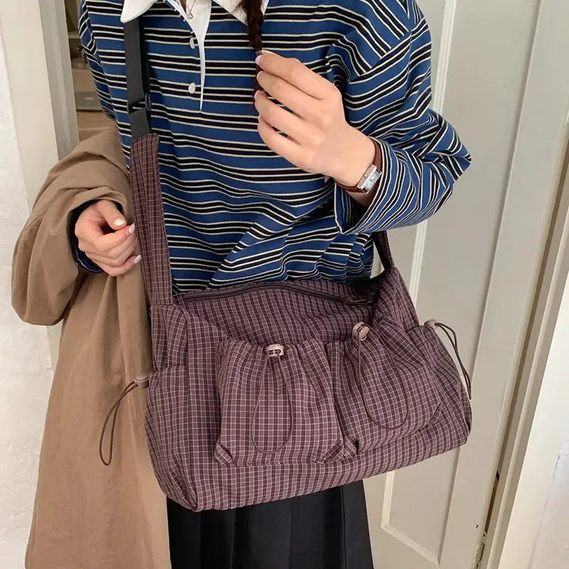 Korean nylon shoulder bag by Simples Market in purple plaid with pleated front pockets