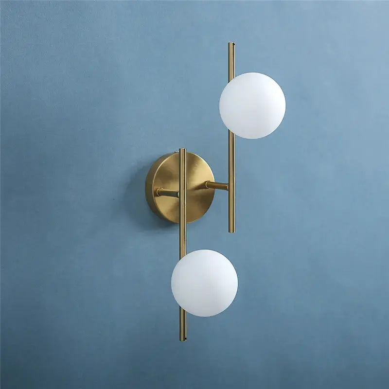 Modern LED wall lamp with brass finish and milky glass globe, Simples Market two G9 bulbs