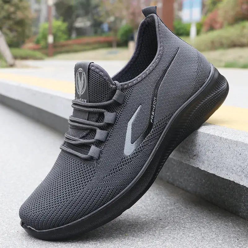 Men's running shoes by Simples Market, gray knit upper, lightweight breathable, non-slip sole.