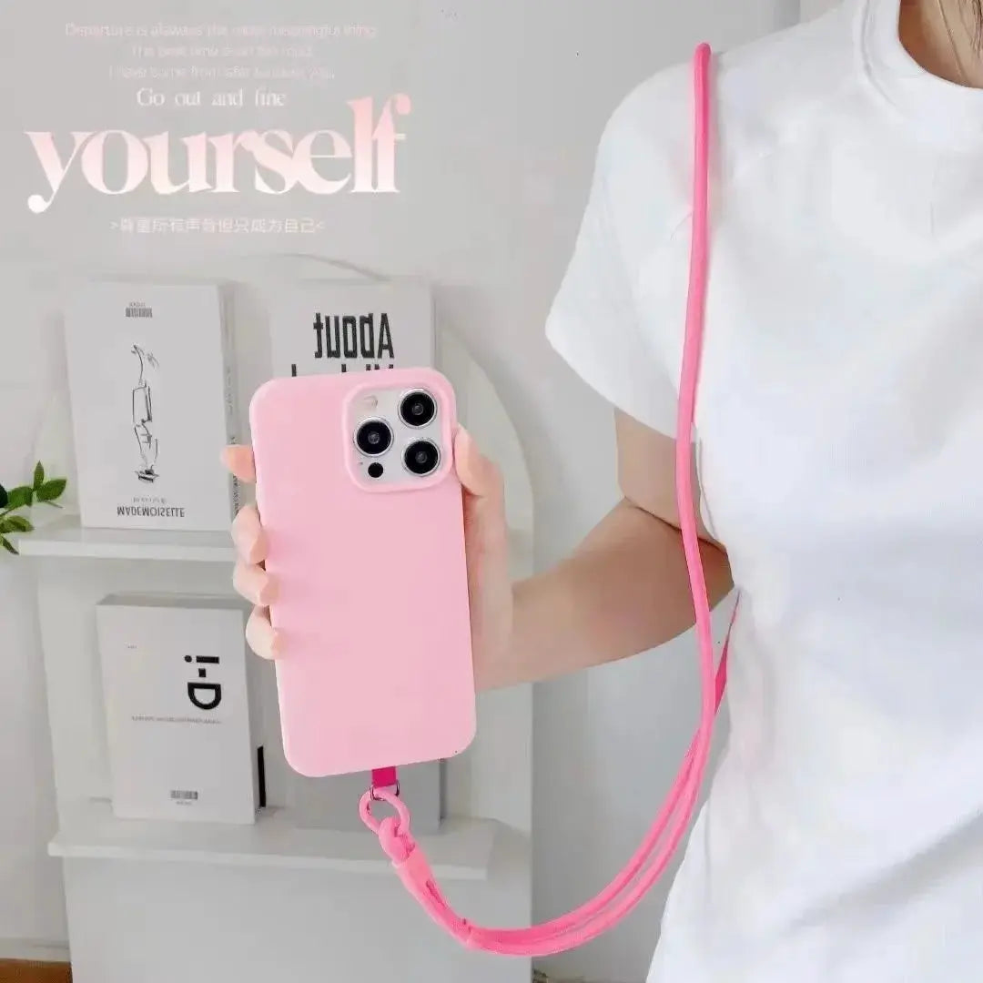 Pink phone lanyard crossbody strap for iPhone; solid color, long rope style.