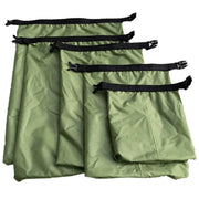 Waterproof dry bag set featuring five green bags with black straps for outdoor protection.