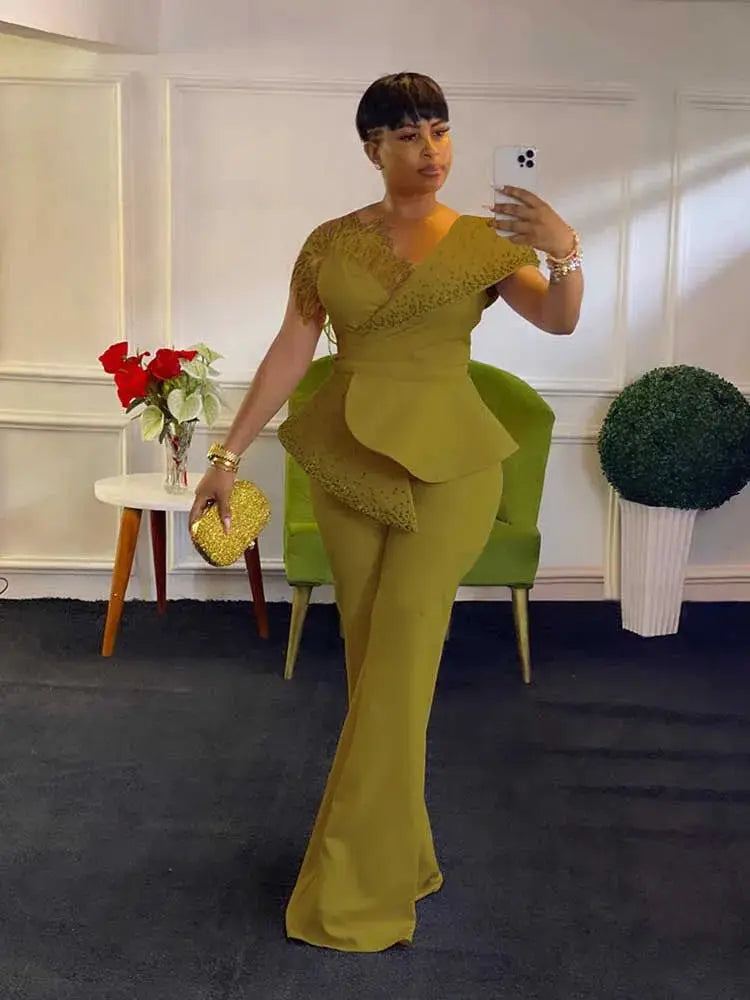High waist strapless jumpsuit in olive green with rivet collar and layered peplum detail for evening wear