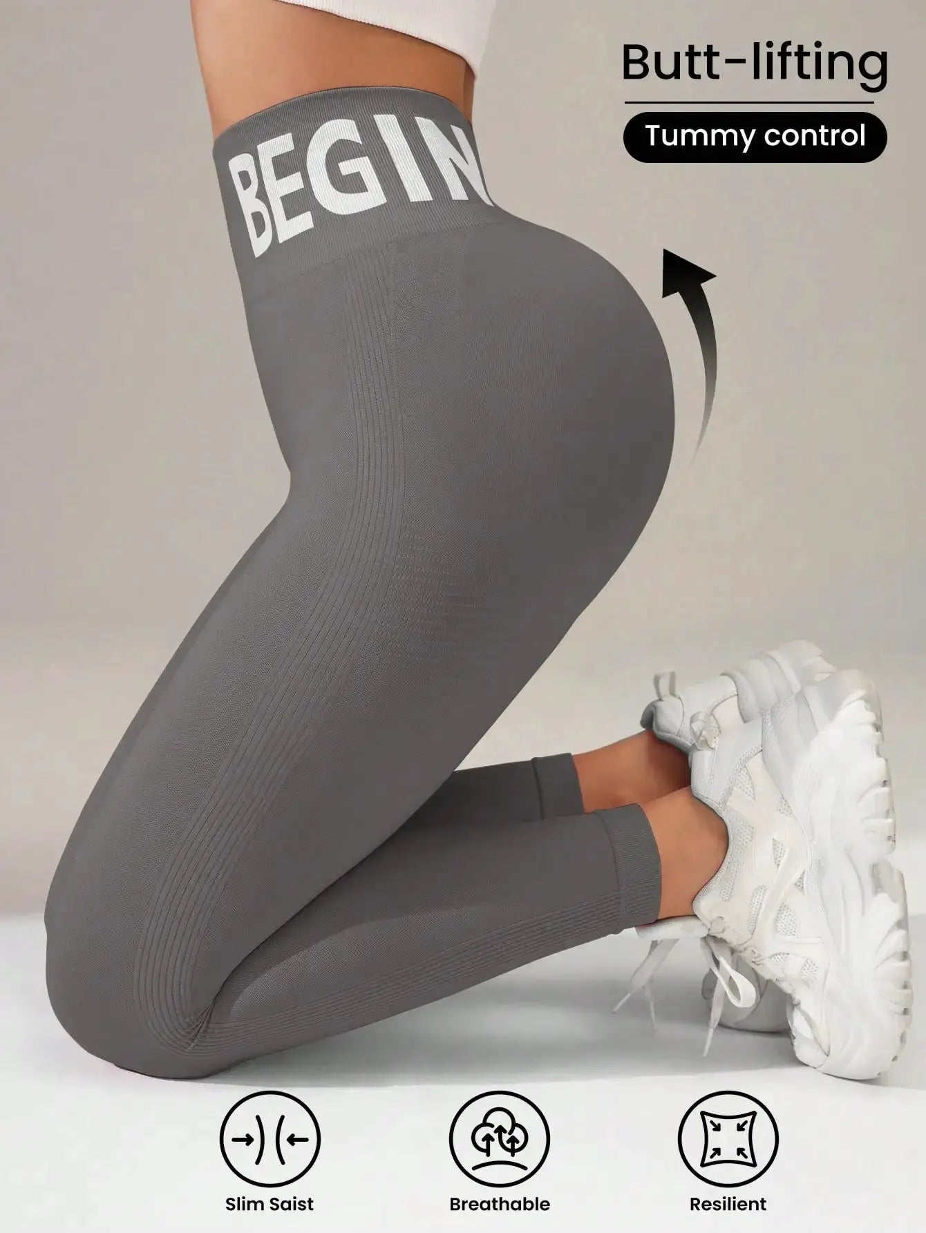 Seamless yoga leggings with bold waistband lettering in gray; butt-lifting, breathable quick-dry tights.