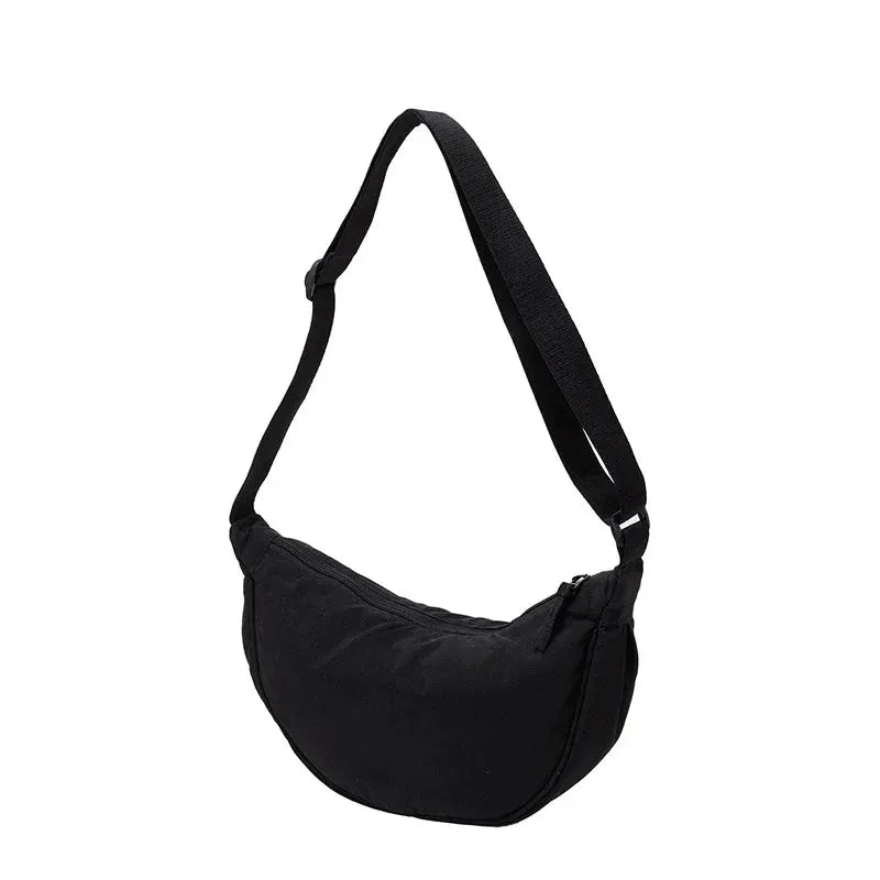 Simples Market nylon crossbody bag, black crescent-shaped dumpling style with adjustable strap and large capacity.