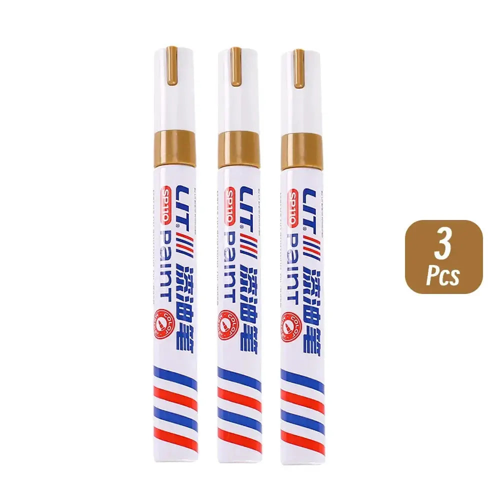 Paint marker pens, 3 pcs white bodies with gold caps and blue/red stripe accents, permanent waterproof markers