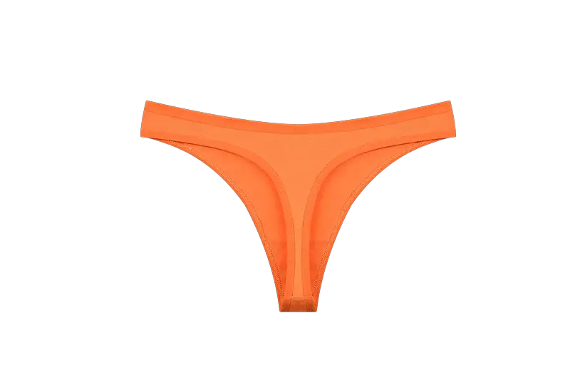 Orange seamless cotton thong underwear, low-waist T-back with thin straps.