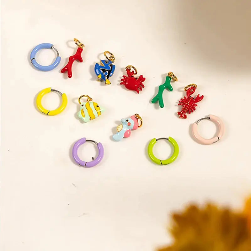Simples Market cartoon animal pendant hoop earrings; assorted colorful hoops with dinosaur, crab and fish charms