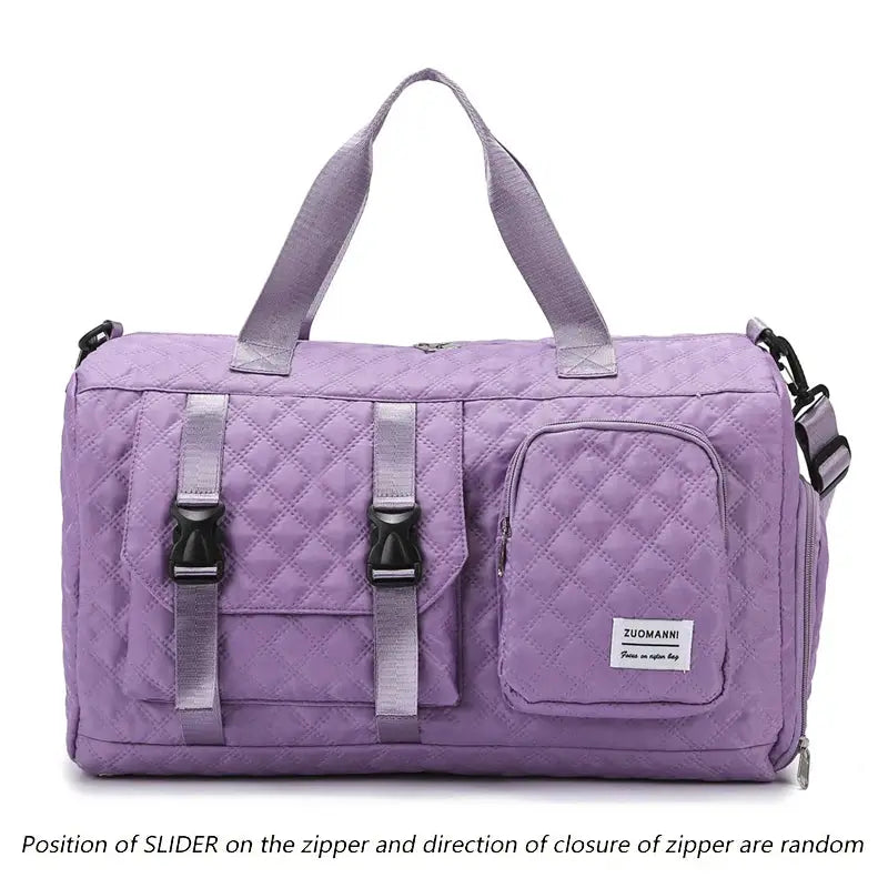 Purple nylon travel duffle bag with quilted pattern, front buckle straps, side zip pocket, and ZUOMANNI logo.