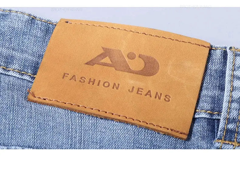 Spring men's light blue slim denim jeans with stretch fabric