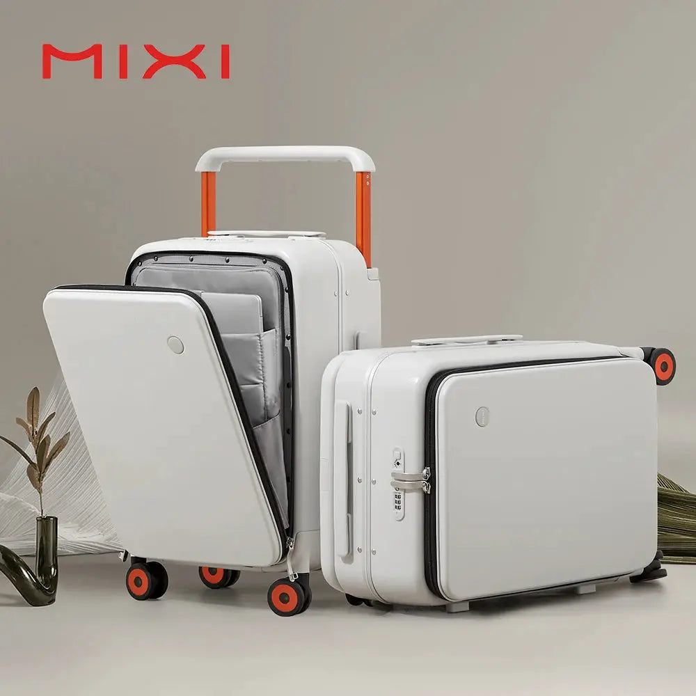 Two white Mixi 20-inch carry-on suitcases with orange wheels and wide handle, one opened to reveal gray interior.