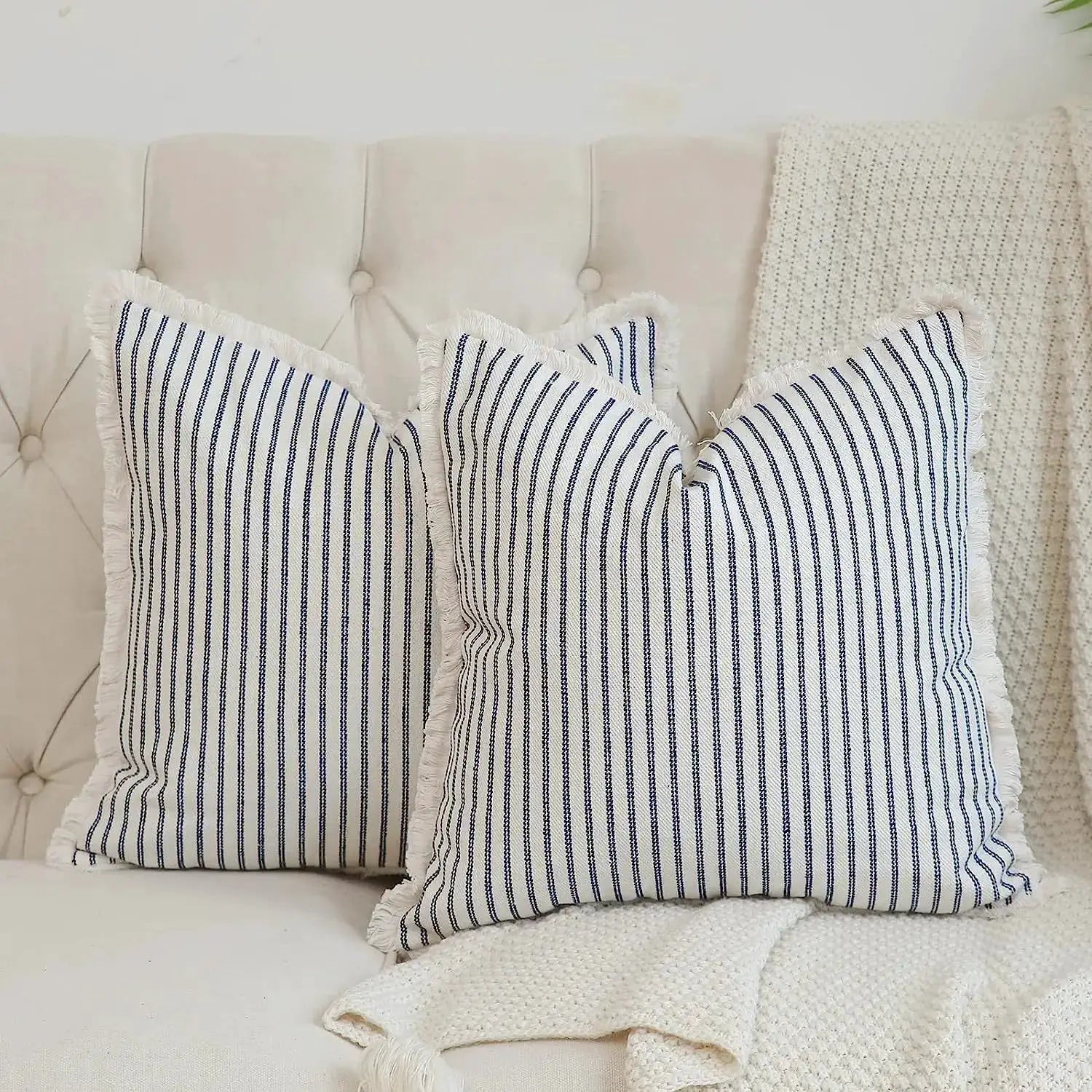 Simples Market two wool striped cushion covers; navy stripes on white with fringe, square pillow covers on beige sofa