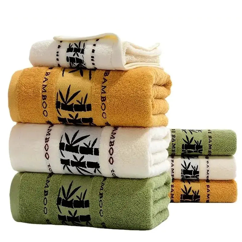 Simples Market bamboo fiber towel set; assorted white/green/mustard towels in 34x74cm and 70x140cm with bamboo band.