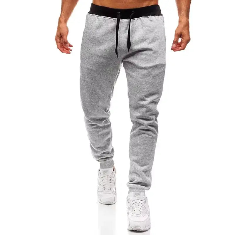 Men's grey jogger pants with loose straight leg and black drawstring waistband, Simples Market