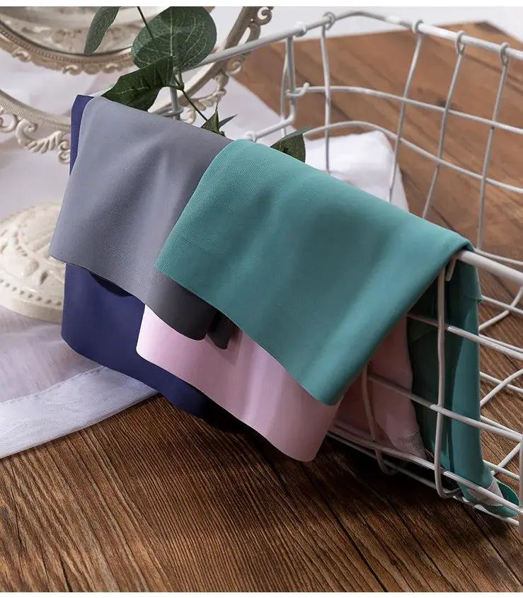 3-piece plus-size underwear set in ice silk, solid pastel colors, displayed on a wire basket
