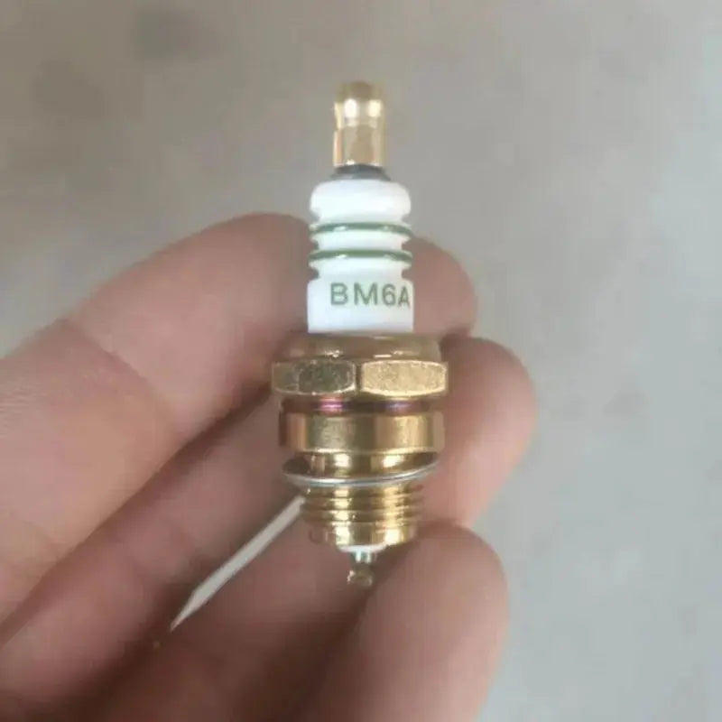 BM6A spark plug for small engines; white ceramic insulator, brass threaded shell, Simples Market