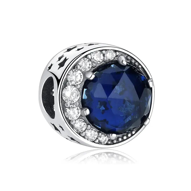 925 Sterling Silver charm bead for bracelets with a deep blue zircon center and surrounding clear crystals