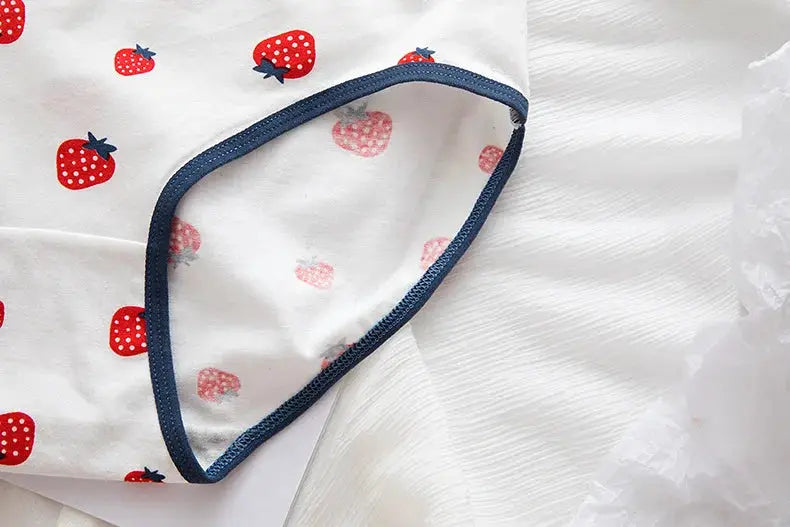 Cotton women’s underwear with strawberry print on white fabric and navy trim