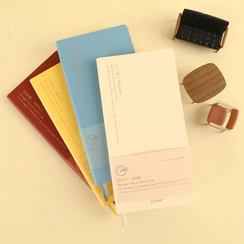 Kinbor weekly planner notebooks set of four in red, yellow, blue and white undated agendas