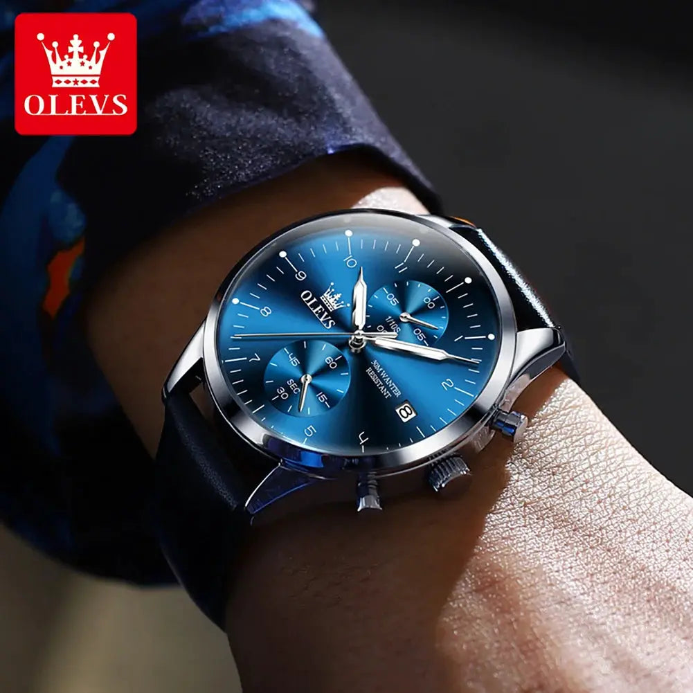 OLEVS men's luxury wristwatch with blue dial, stainless steel case, leather strap, and date function