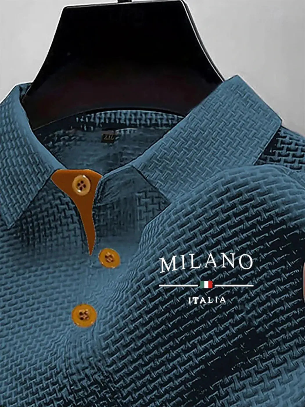 Men's polo shirt by Simples Market; blue textured fabric with orange collar placket and buttons, Milano Italia logo visible