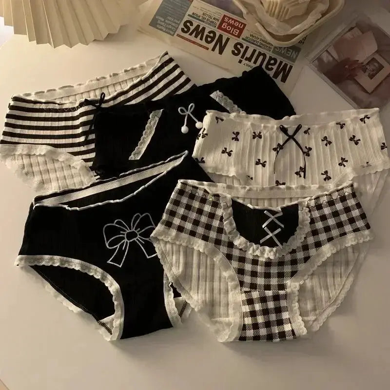 Six cotton seamless women's panties in black, white, striped and checkered patterns with lace trim and bow accents.