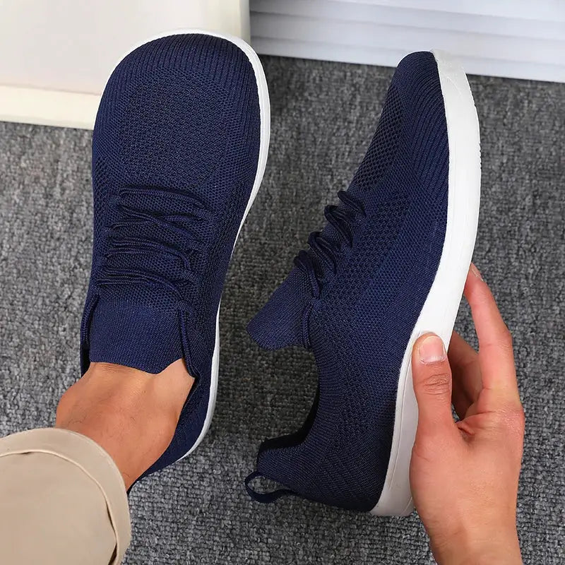 Men's wide-toe minimalist sports shoes in navy knit with white sole; two shown