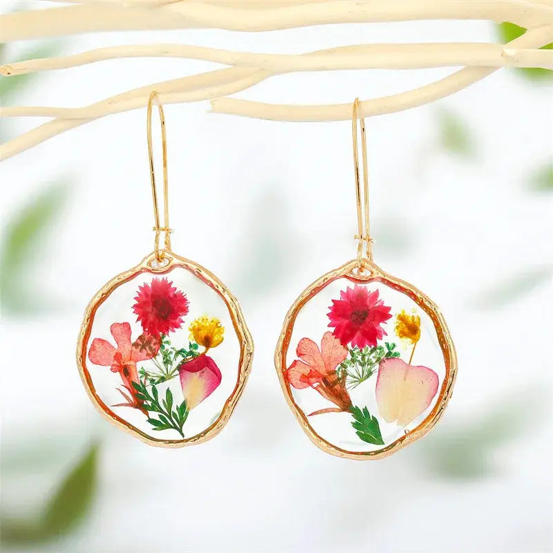 Simples Market pair of flower dangle earrings with pressed flowers in epoxy resin, gold-tone bezel and hooks