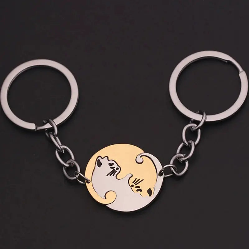 Cute Cat Hug Keychain with stainless steel rings and a two-cat gold-and-white round pendant