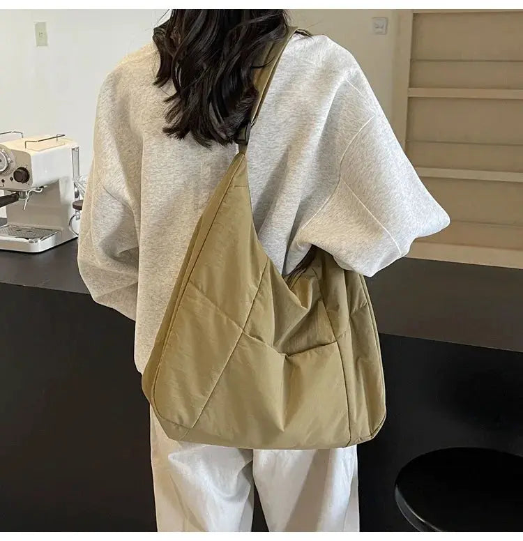 Womens soft cloth shoulder bag in khaki beige with diagonal quilted panels, crossbody style